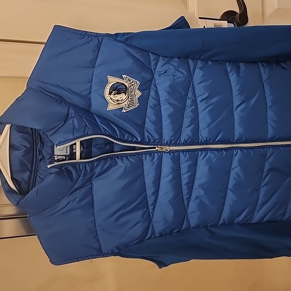 NBA for her Dallas Mavericks vest
